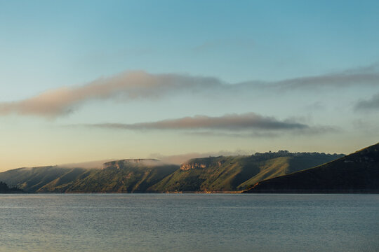 Misty Mountain Landscape with a River at Sunrise