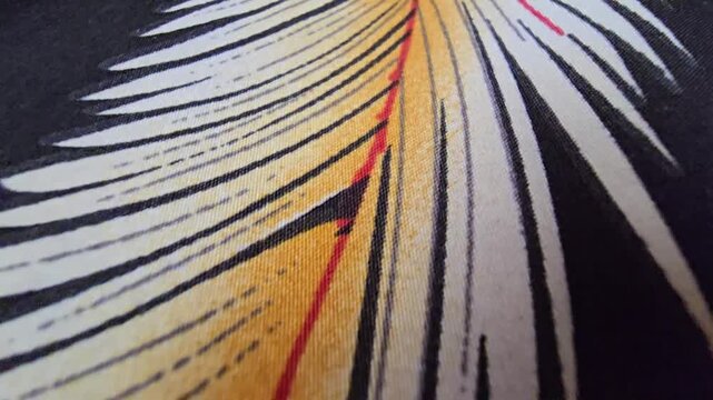 Macro close-up of a textured fabric with parallel mustard yellow, black, and white striped pattern and a bold central red line, high-quality textile background, abstract artistic woven material detail