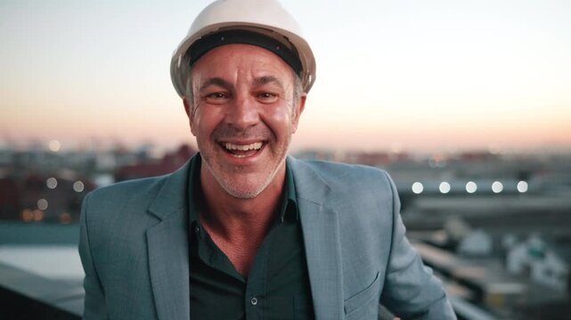 Face, man and engineer outdoor with helmet, inspection and architecture for infrastructure. Portrait, mature person and contractor on rooftop, positive attitude and quality control for construction
