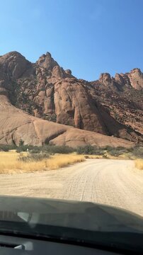 POV shot driving around Spitzkoppe in the Namib Desert, Namibia.