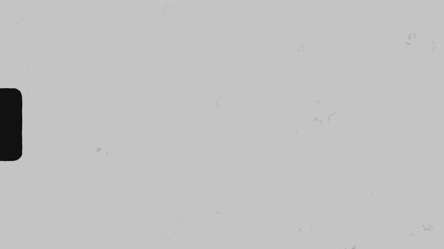 Vintage film grain with sprocket holes on a grey background