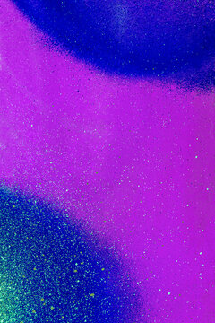 colorful background pattern of urban streen wall graffiti for concept and design. Aerosol bright vivid painting on a city walls