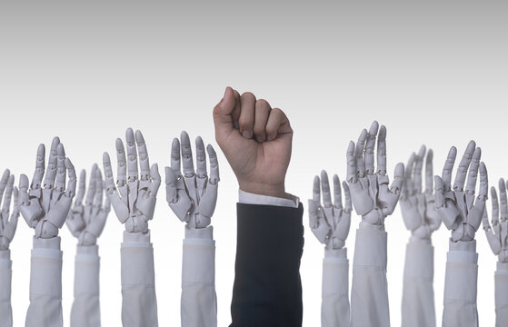 Human fist standing out from robotic hands, revolution and power of humanity