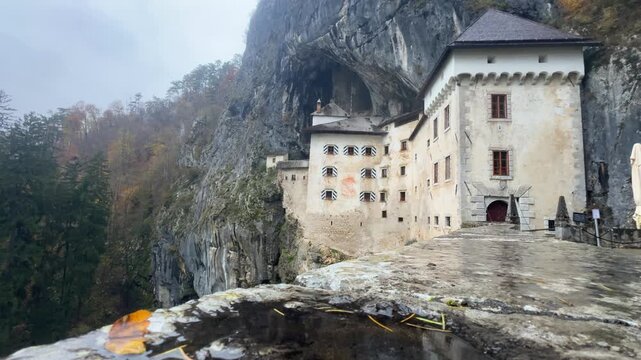 Predjama Castle, a medieval marvel in Slovenia, nestled in the mouth of a cliffside cave.