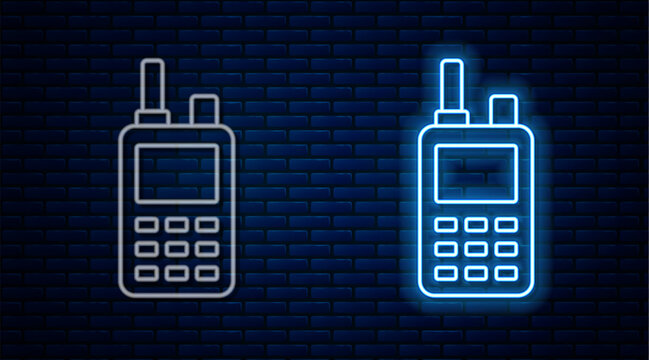 Glowing neon line Walkie talkie icon isolated on brick wall background. Portable radio transmitter icon. Radio transceiver sign. Vector