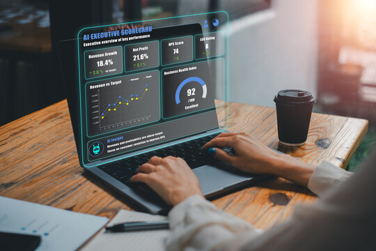 Digital interface showcasing AI-driven executive scorecard with business metrics and analytics on a laptop screen in a contemporary workspace.