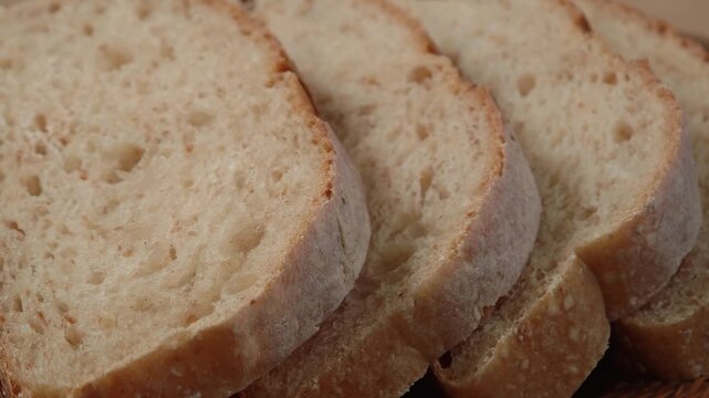 Close-up of sliced ​​piece of whole grain bread. Bread crumb texture, artisan sourdough organic bread macro photography.
