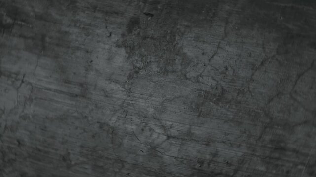 Dark grunge concrete wall texture with cracks and weathered surface