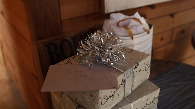 Stack of congratulations gift boxes with ribbons