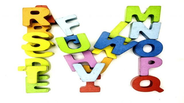 The alphabet makes the letter M with colored wooden letters 