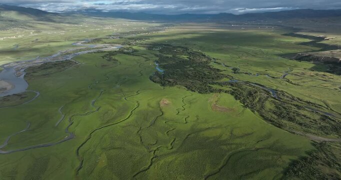 Beautiful curving rivers and green grassland in Litang county, China