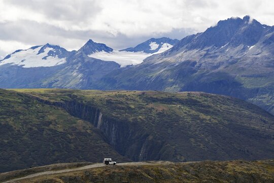Small truck camper in wild mountain landscape, Chugach Mountains, Thompson Pass, Richardson Highway, Alaska, USA