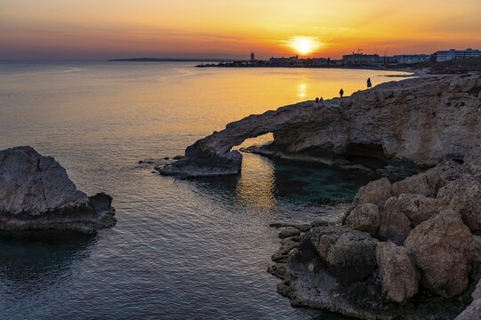 The natural rock bridge Love Bridge in the sunset, Agia Napa, Cyprus