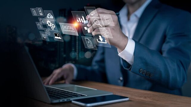 Businessman holding a pen to select a virtual digital transformation icon on a laptop with a city skyline double exposure, managing smart technology workflow automation and data process systems.