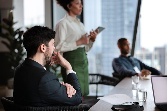 Man is yawning in a business meeting 