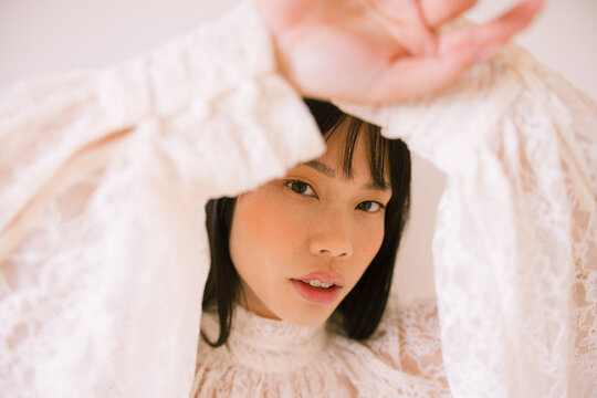 Portrait Framed by Lace Sleeves