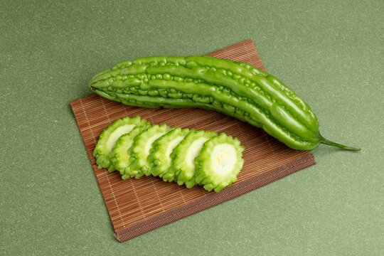 Bitter gourd on a green background