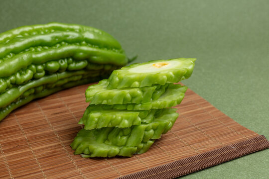 Bitter gourd on a green background