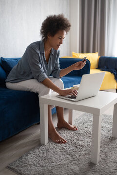 Black woman browsing online shop website