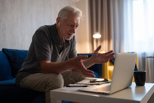 Senior male making video call during work at home
