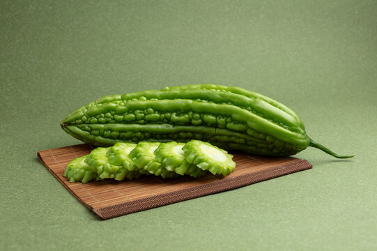 Bitter gourd on a green background