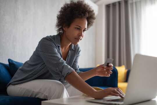 Black female doing online shopping
