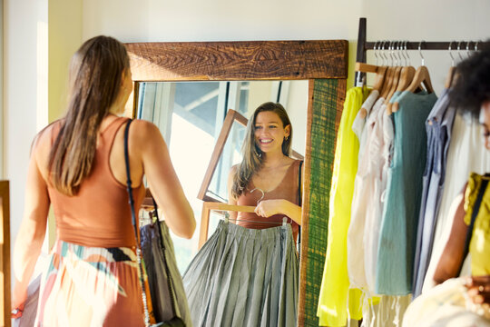 Customer Checks Reflection in Store Mirror