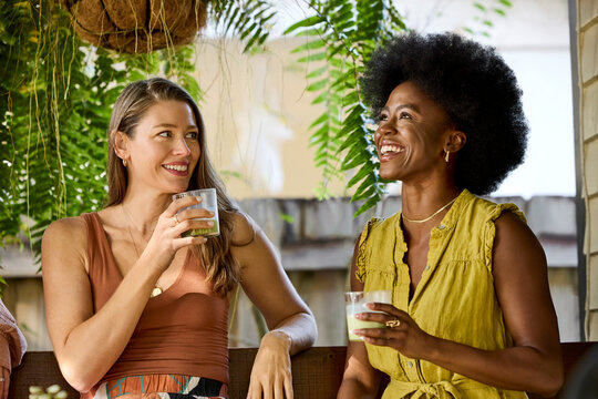Friends Enjoying Drinks in a Garden Setting