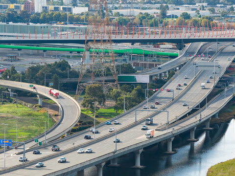 Traffic on busy freeways overpasses in an urbacn cityscape