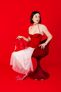 Woman siting in red fashion 