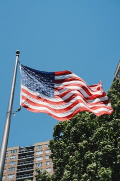 American Flag Above City Street