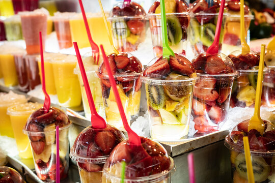 Fresh Fruit Cups at a Market Stall During a Sunny Day