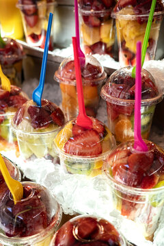 Colorful Fruit Cups on Display at a Market Stall in the Summer