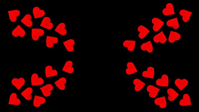 Symmetrical red hearts wings pattern animation on a black background for romantic Valentine's Day celebrations, wedding greetings, and love themed video background loop.
