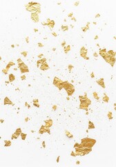 Fototapeta premium Elegant Gold Leaf Flakes and Glitter Dust Scattered on White Background for Luxury Design Projects