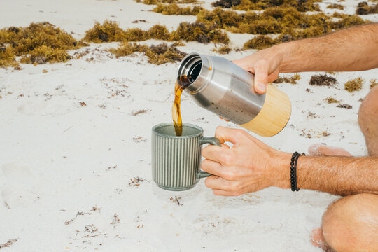 Pouring Coffee Into Mug on Gulf Coast Beach