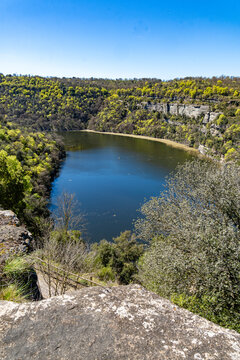 Sau reservoir water flowing through forested valley, sant pere de casserres, Vic, Spain