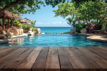Fototapeta premium Wooden table foreground with a tropical pool and ocean view, surrounded by lush greenery and thatched-roof structures under a clear blue sky