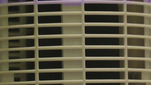 Macro pattern of electronic grid panel with changing neon lights