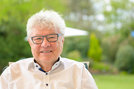 Happy Senior Man Relaxing Outdoors