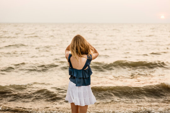 portrait of a girl looking at a lake