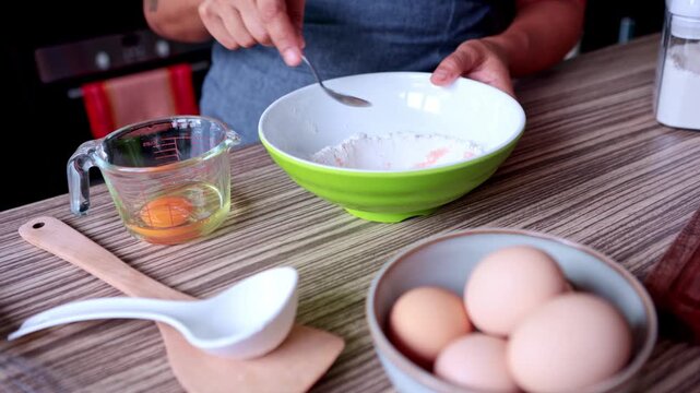 Chef adding himalayan salt to flour for making fresh pasta