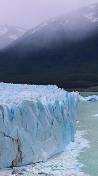 Perito Moreno Glacier wall with mountains in El Calafate