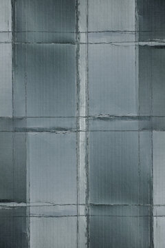 gray crumpled paper texture featuring subtle fold marks, geometric grid lines, and a distressed matte surface.