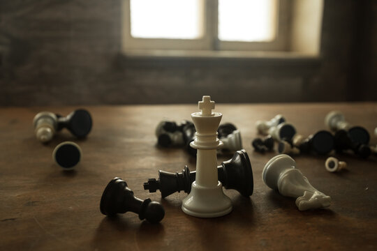 Chess board game concept of business ideas and competition and strategy ideas concep. Chess figures on a dark background with smoke and fog. Selective focus