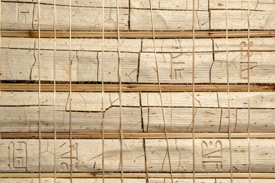 Ancient Papyrus and Woven Reed Texture Background with Hieroglyphs