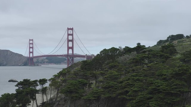 Golden Gate Bridge From Baker Beach Sandy Shoreline On Overcast Day - Wide, Aerial Shot