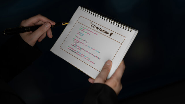 A close-up view of hands holding a notepad showcasing code snippets for an AI code assistant, illuminated in a softly lit environment, perfect for showcasing technology in action. Cyphers