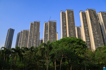 Modern Residential High Rise Towers Above Green Urban Park © TrinhBaoTran
