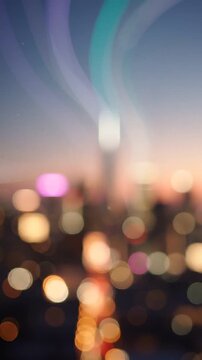 Captivating Urban Sunset: A Dreamy View of Blurred City Lights and Skyscrapers at Dusk with a Soft Color Palette Exhibiting a Serene Atmosphere of Evening Life